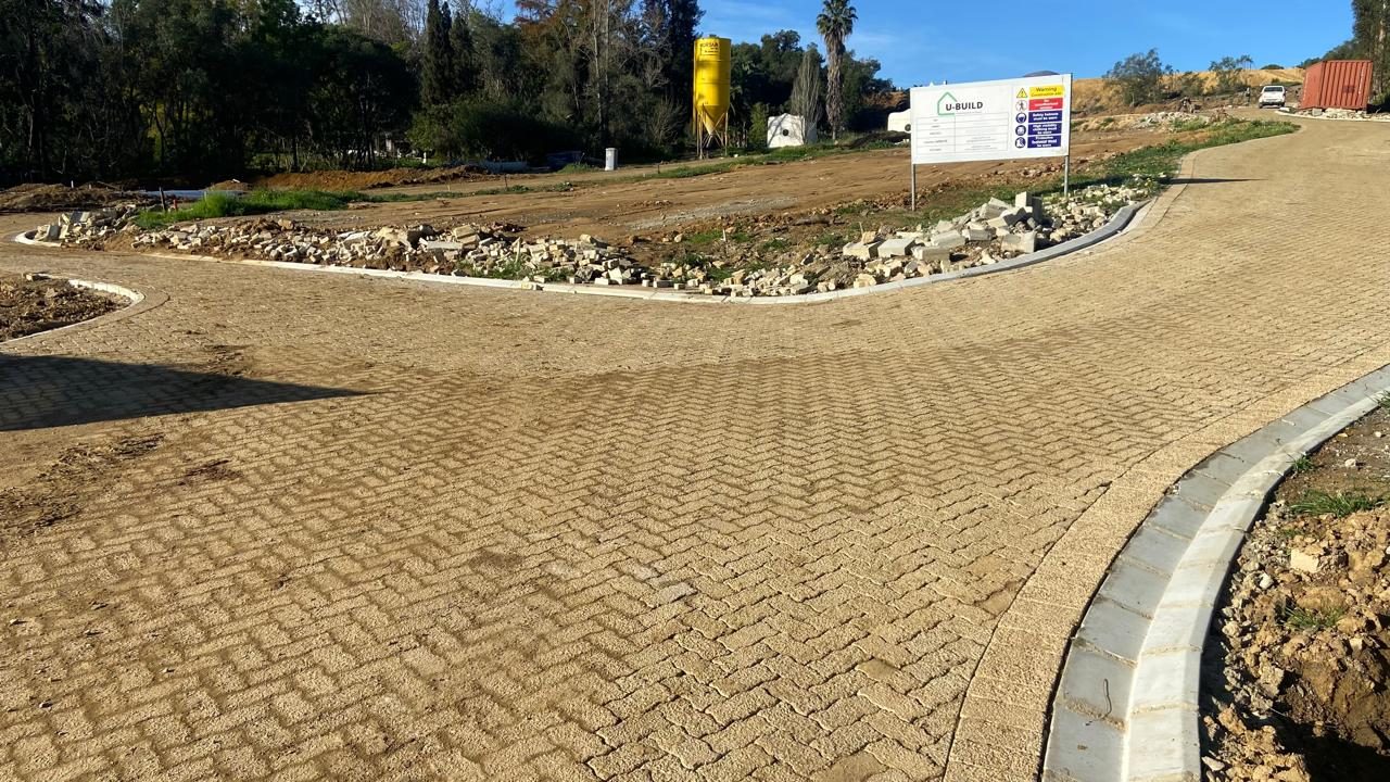 Completed herringbone access road with kerbs