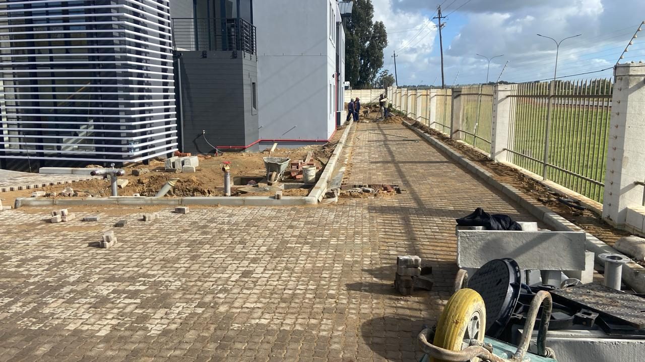 Paving and kerbing alongside an office building