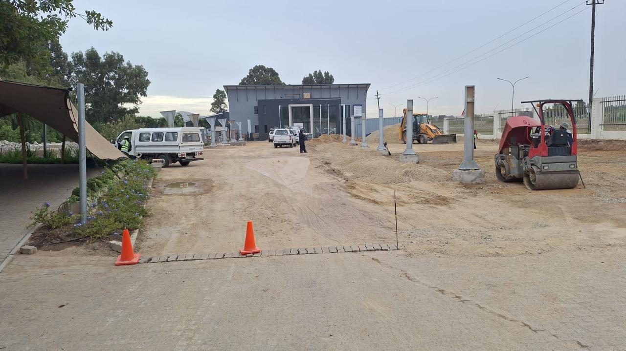 Base layer being compacted with a roller